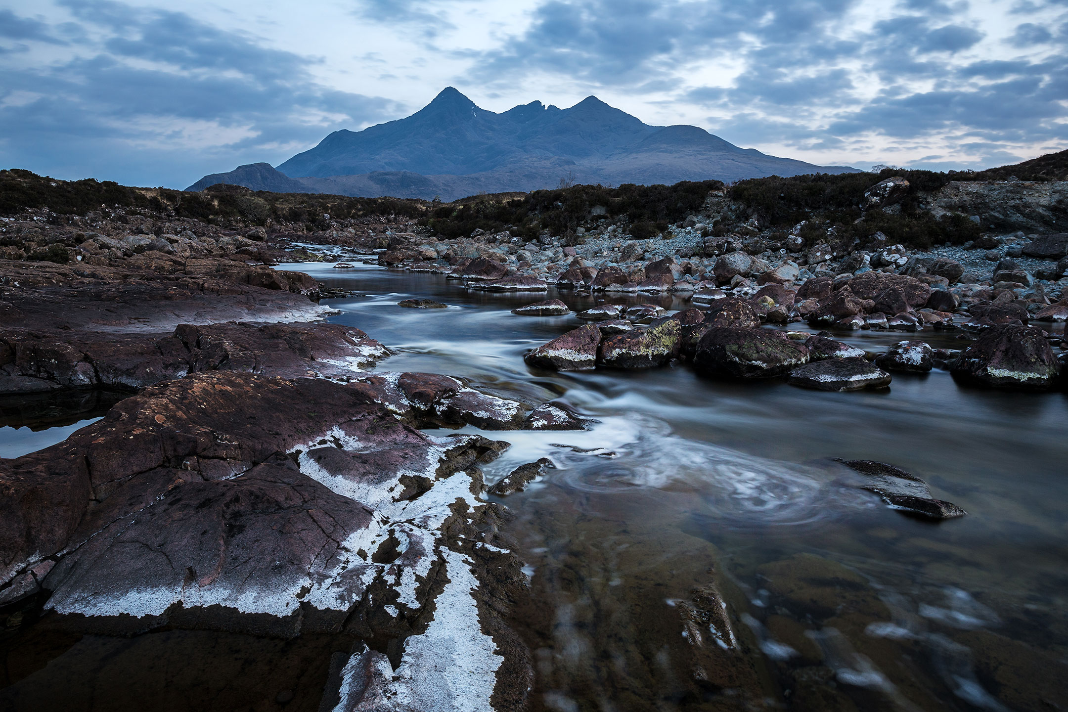 A blue dusk over the Black Cuillin Mountains at Sligachan on the Isle of Skye, Scotland