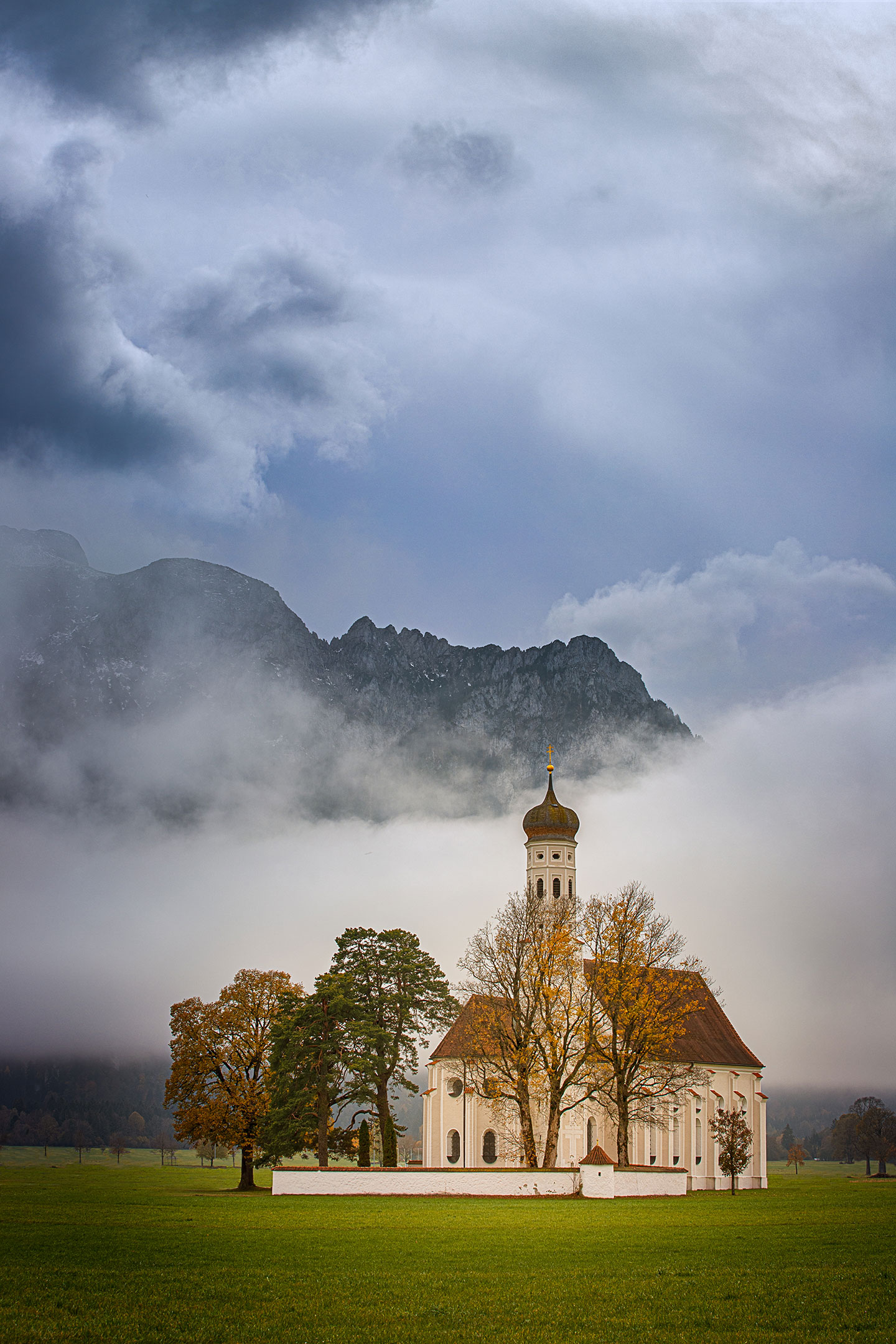 A break in the clouds over Eglise St Coloman, Schwangau, Germany