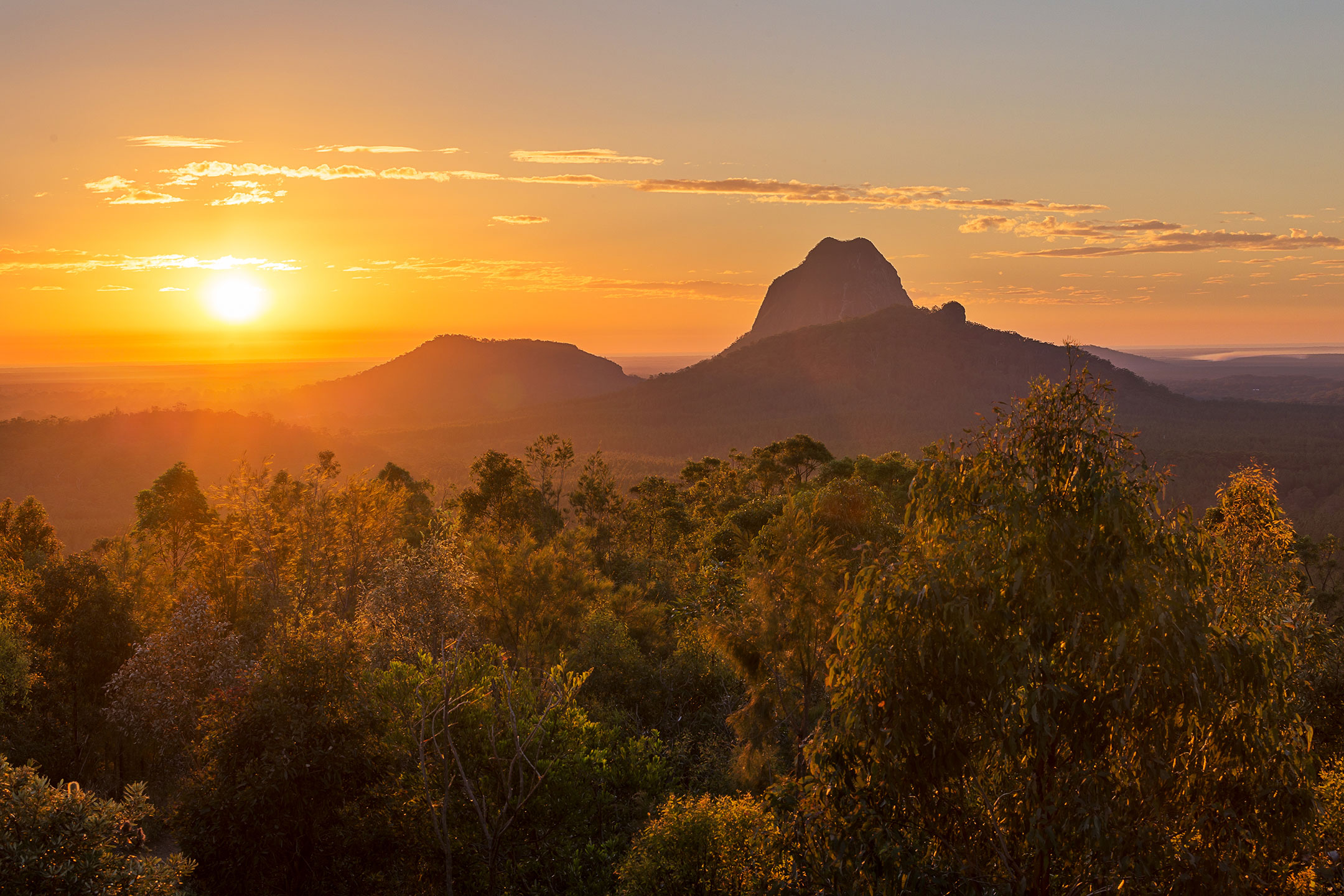 Sunrise beside Mount Tibrogargan, Glass House Mountains, Sunshine Coast Australia